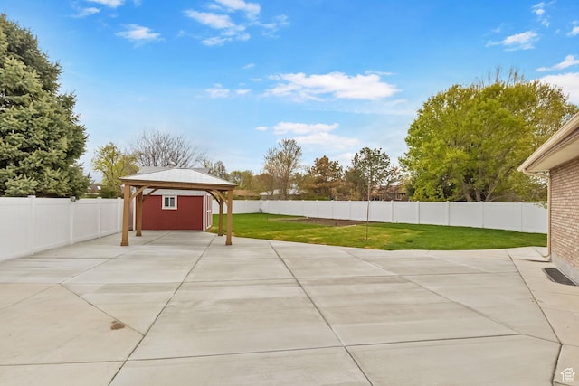 view of patio with a gazebo and a fenced backyard