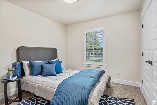 carpeted bedroom with baseboards
