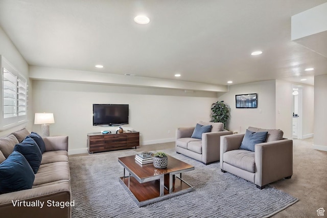 living area with baseboards, carpet flooring, and recessed lighting