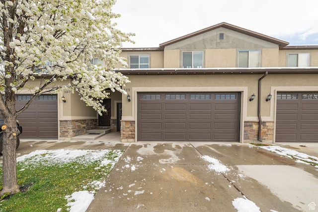 111 E 690 S, Smithfield, UT 84335 - townhome / multi-family property with stone siding, stucco siding, concrete driveway, and a garage
