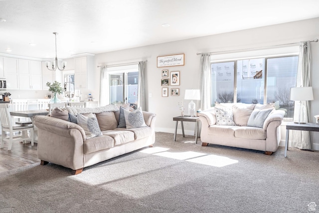 16 N 1000 E, Hyde Park, UT 84318 - living room featuring recessed lighting, carpet, baseboards, and an inviting chandelier