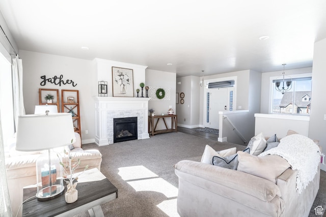 16 N 1000 E, Hyde Park, UT 84318 - living room with a glass covered fireplace, carpet flooring, and baseboards