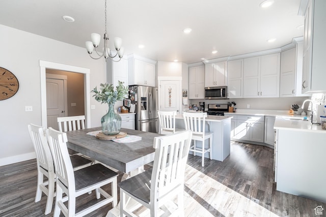 16 N 1000 E, Hyde Park, UT 84318 - dining area with recessed lighting, dark wood-style flooring, and an inviting chandelier