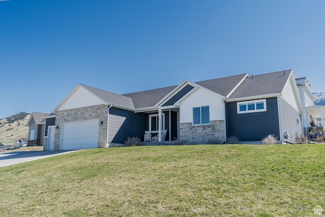 16 N 1000 E, Hyde Park, UT 84318 - single story home featuring stone siding, an attached garage, a front lawn, and concrete driveway