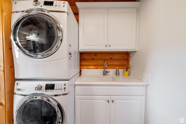 2592 S 2900 E, New Harmony, UT 84757 - clothes washing area with cabinet space, stacked washing maching and dryer, and a sink