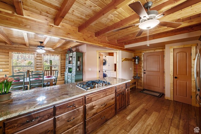 2592 S 2900 E, New Harmony, UT 84757 - kitchen with rustic walls, stacked washer / dryer, ceiling fan, and wooden ceiling