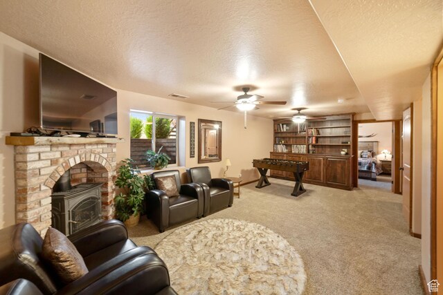 2592 S 2900 E, New Harmony, UT 84757 - living room with a wood stove, a textured ceiling, visible vents, and light colored carpet