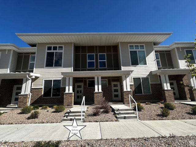 5487 W Fade Ct S, West Valley City, UT 84120 - multi unit property with brick siding and a porch