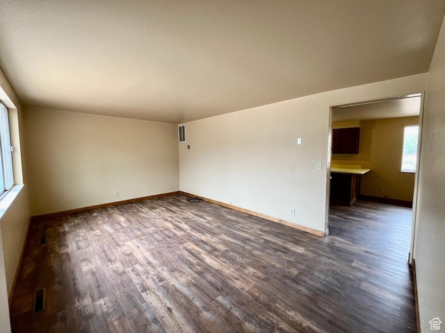 736 Westwood Ave, Moab, UT 84532 - spare room featuring baseboards, dark wood-type flooring, and visible vents