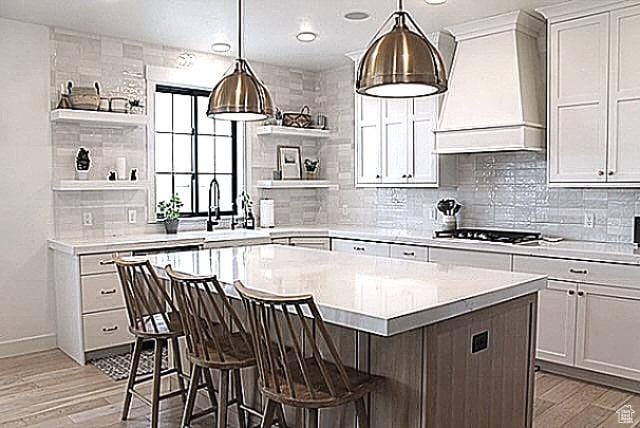 7226 Estancia Ln, Smithfield, UT 84335 - kitchen featuring open shelves, custom range hood, cooktop, light countertops, and recessed lighting