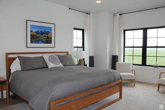 7226 Estancia Ln, Smithfield, UT 84335 - bedroom featuring multiple windows, wood finished floors, and recessed lighting