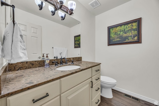 2251 Ridgewood Way, Bountiful, UT 84010 - half bathroom with wood finished floors, visible vents, toilet, and baseboards