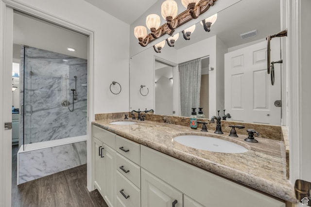 2251 Ridgewood Way, Bountiful, UT 84010 - bathroom with wood finished floors, visible vents, a marble finish shower, and a sink