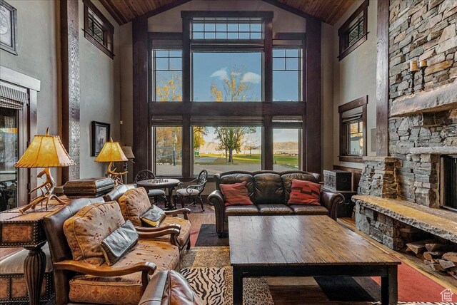 57 E 445 S, Garden City, UT 84028 - living room featuring a fireplace, wood finished floors, wood ceiling, and high vaulted ceiling