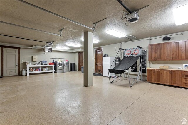 57 E 445 S, Garden City, UT 84028 - garage with washing machine and dryer, freestanding refrigerator, and a garage door opener