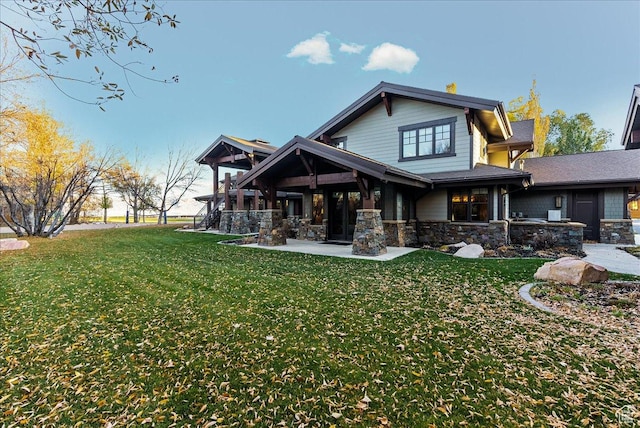57 E 445 S, Garden City, UT 84028 - back of property with a lawn and stone siding
