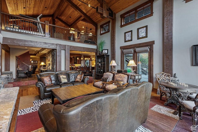 57 E 445 S, Garden City, UT 84028 - living area with high vaulted ceiling, stairs, wood finished floors, beamed ceiling, and wooden ceiling