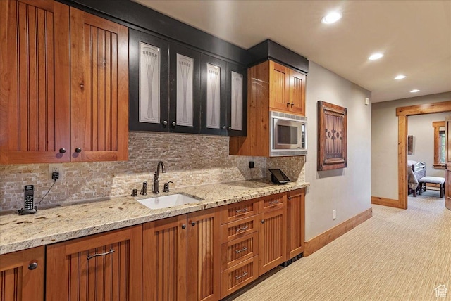 57 E 445 S, Garden City, UT 84028 - kitchen with a sink, stainless steel microwave, baseboards, backsplash, and light colored carpet