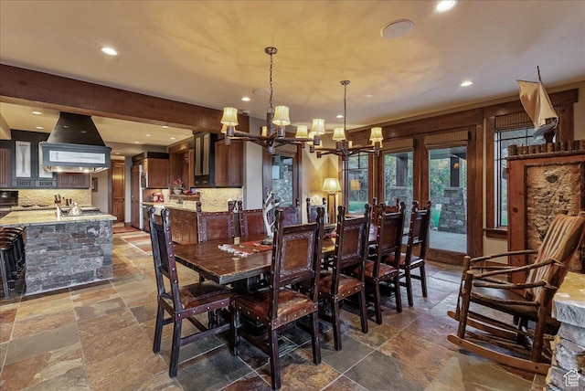 57 E 445 S, Garden City, UT 84028 - dining space featuring stone tile flooring, a notable chandelier, and recessed lighting