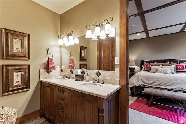 57 E 445 S, Garden City, UT 84028 - ensuite bathroom featuring double vanity, ensuite bath, decorative backsplash, and a sink