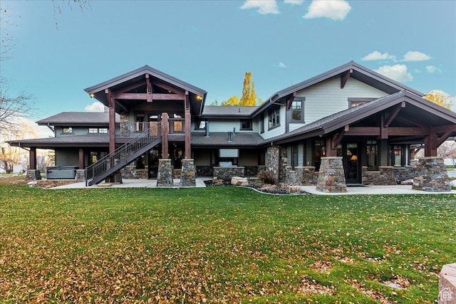 57 E 445 S, Garden City, UT 84028 - rear view of house with a yard, a patio area, stone siding, and stairs