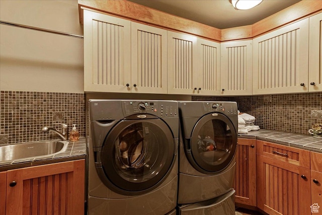 57 E 445 S, Garden City, UT 84028 - washroom with cabinet space, washer and clothes dryer, and a sink