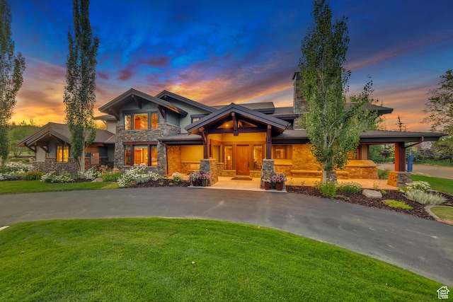 57 E 445 S, Garden City, UT 84028 - craftsman-style house featuring stone siding, a chimney, and a yard