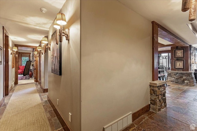 57 E 445 S, Garden City, UT 84028 - hallway with baseboards, stone tile floors, and visible vents