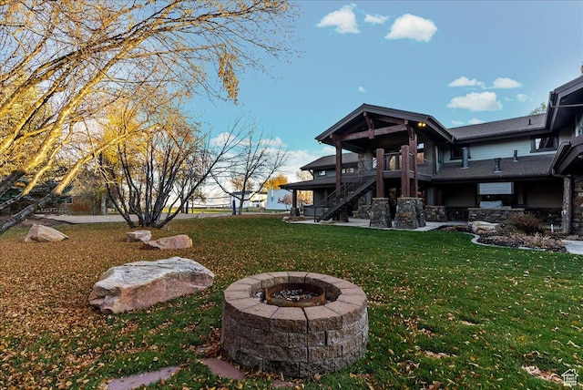 57 E 445 S, Garden City, UT 84028 - view of yard featuring a fire pit, a patio area, stairs, and a deck