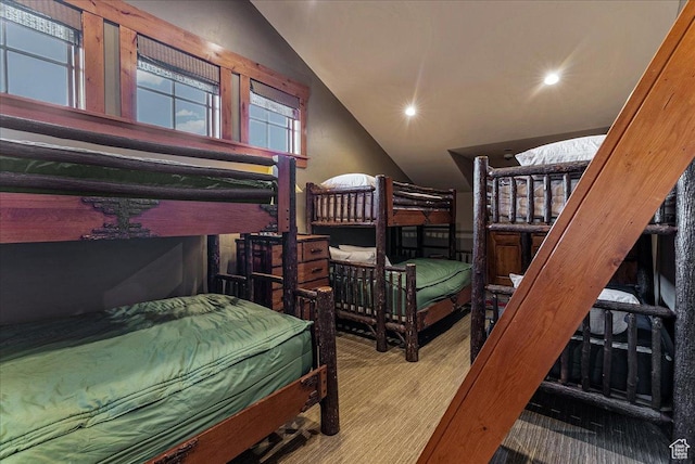 57 E 445 S, Garden City, UT 84028 - bedroom featuring lofted ceiling, wood finished floors, and recessed lighting