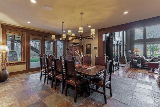 57 E 445 S, Garden City, UT 84028 - dining area with baseboards, stone tile flooring, an inviting chandelier, and recessed lighting