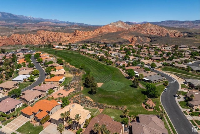 890 N Sky Mountain Ct, Hurricane, UT 84737 - aerial overview of property's location featuring a mountainous background, nearby suburban area, and a golf course