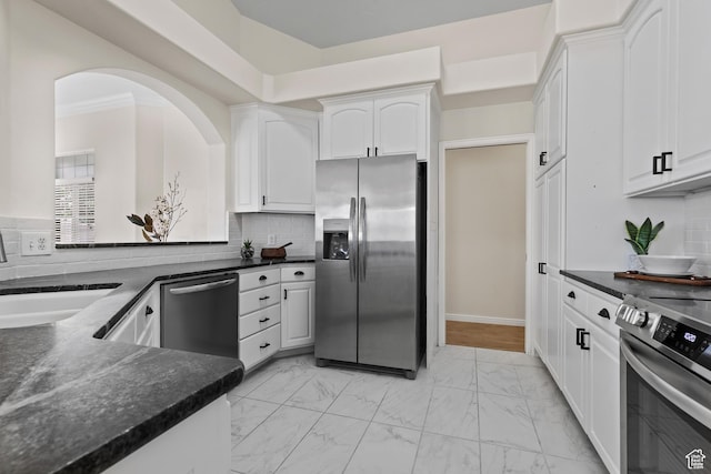 890 N Sky Mountain Ct, Hurricane, UT 84737 - kitchen with stainless steel appliances, light marble finish floors, white cabinetry, decorative backsplash, and a sink
