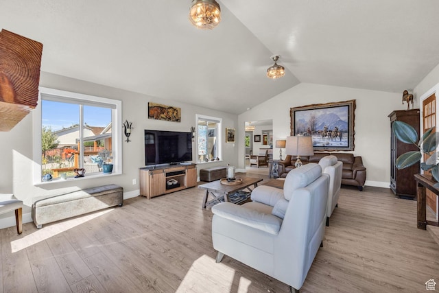 9185 S 200 W, Paradise, UT 84328 - living room featuring baseboards, vaulted ceiling, and light wood-style flooring