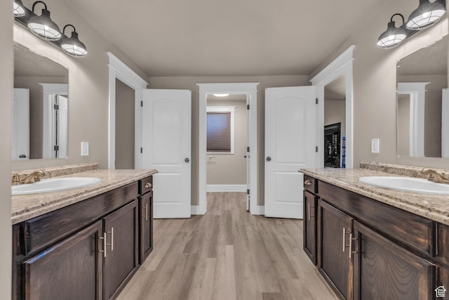 9185 S 200 W, Paradise, UT 84328 - full bath with two vanities, wood finished floors, and a sink