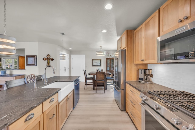 9185 S 200 W, Paradise, UT 84328 - kitchen featuring a sink, plenty of natural light, backsplash, appliances with stainless steel finishes, and recessed lighting