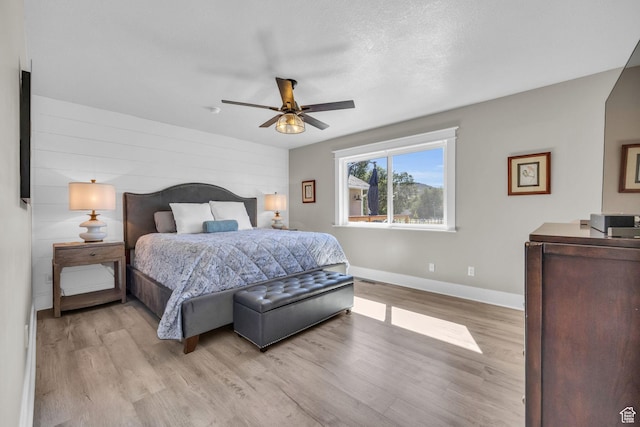 9185 S 200 W, Paradise, UT 84328 - bedroom featuring light wood finished floors, a ceiling fan, and baseboards