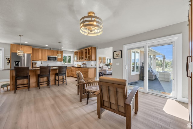 9185 S 200 W, Paradise, UT 84328 - dining area featuring recessed lighting, a wealth of natural light, an inviting chandelier, and light wood-style flooring