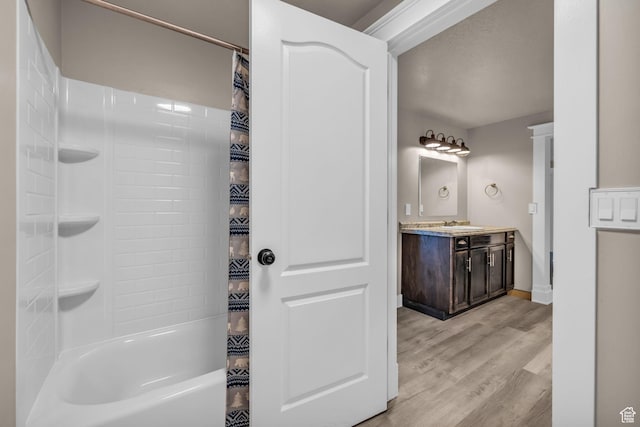 9185 S 200 W, Paradise, UT 84328 - bathroom with baseboards, wood finished floors, shower / tub combo, and vanity