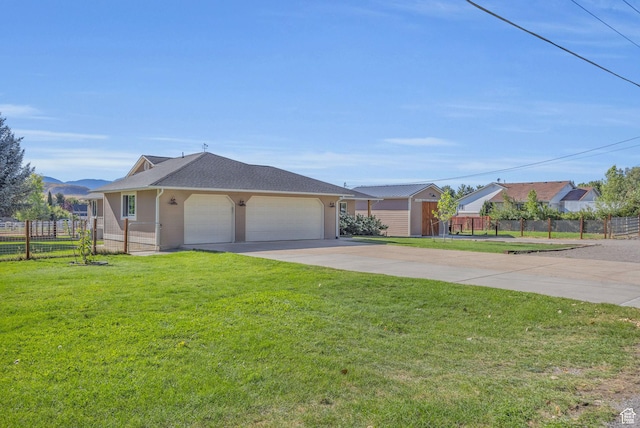 9185 S 200 W, Paradise, UT 84328 - single story home featuring roof with shingles, concrete driveway, fence, an attached garage, and a front yard