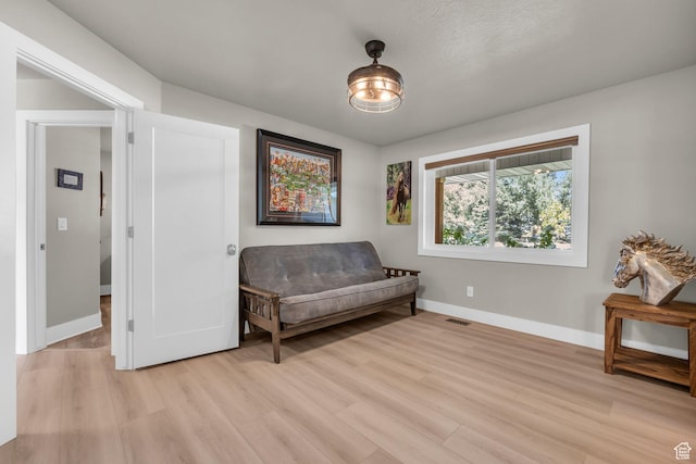 9185 S 200 W, Paradise, UT 84328 - living area with baseboards, visible vents, and light wood-style flooring