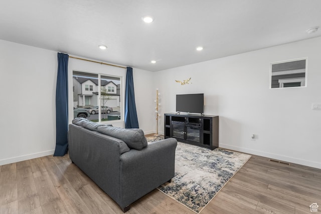 488 N Trident Dr, Saratoga Springs, UT 84045 - living area with recessed lighting, wood finished floors, visible vents, and baseboards