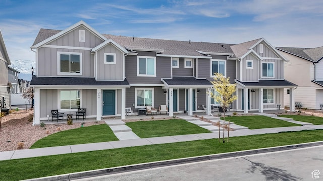 488 N Trident Dr, Saratoga Springs, UT 84045 - multi unit property featuring board and batten siding, a shingled roof, a porch, and a front yard