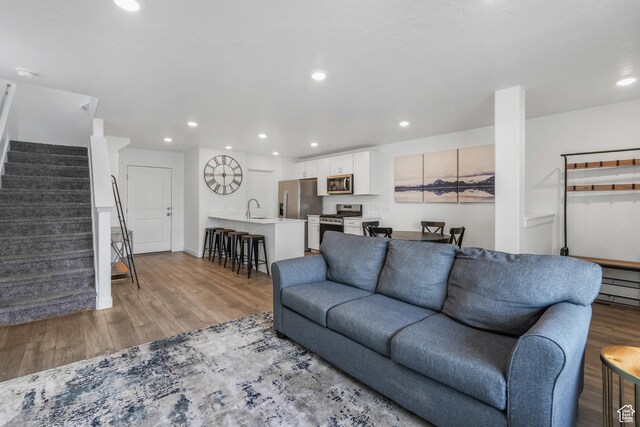 488 N Trident Dr, Saratoga Springs, UT 84045 - living area with recessed lighting, light wood-style floors, and stairway