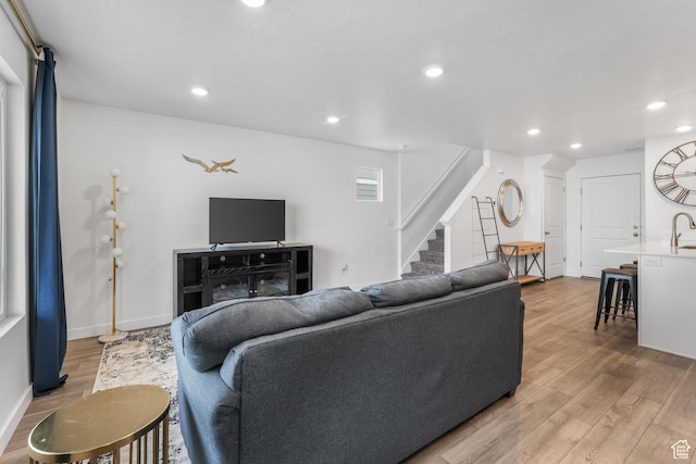 488 N Trident Dr, Saratoga Springs, UT 84045 - living room with recessed lighting, wood finished floors, baseboards, and stairs