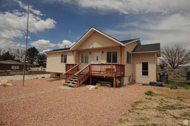 back of property featuring fence