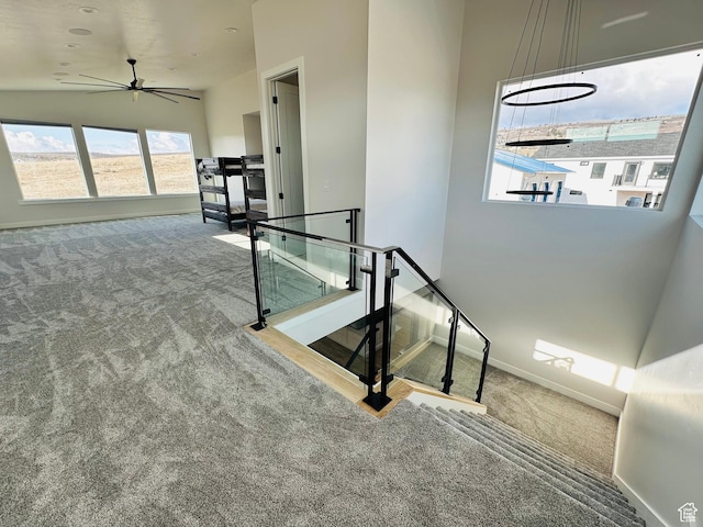 2747 S Country Club Way, Garden City, UT 84028 - staircase featuring carpet and ceiling fan