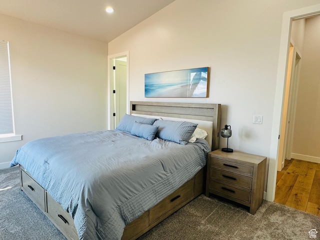 2747 S Country Club Way, Garden City, UT 84028 - bedroom with dark colored carpet, lofted ceiling, and recessed lighting