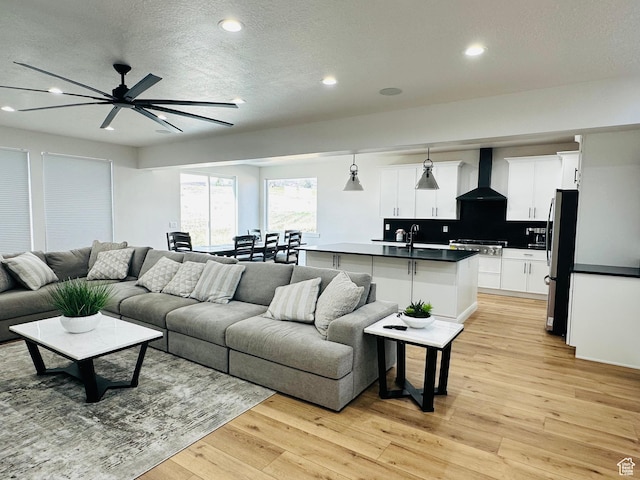 2747 S Country Club Way, Garden City, UT 84028 - living area featuring recessed lighting, ceiling fan, light wood-style floors, and a textured ceiling