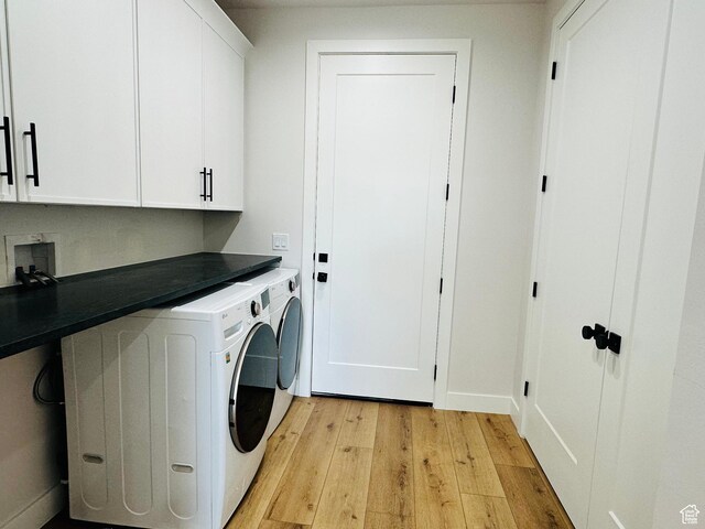 2747 S Country Club Way, Garden City, UT 84028 - laundry area featuring cabinet space, light wood-type flooring, and washing machine and dryer